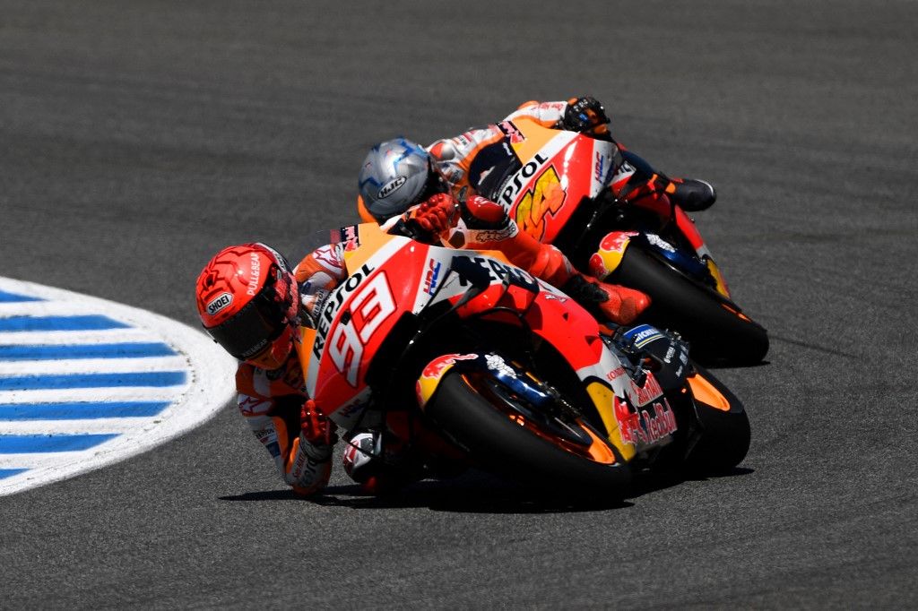 Marquez Repsol Honda Team's Spanish rider Marc Marquez (L) and Repsol Honda Team's Spanish rider Pol Espargaro ride during the MotoGP race of the Spanish Grand Prix at the Jerez Circuit in Jerez de la Frontera on May 2, 2021. (Photo by PIERRE-PHILIPPE MARCOU / AFP)
