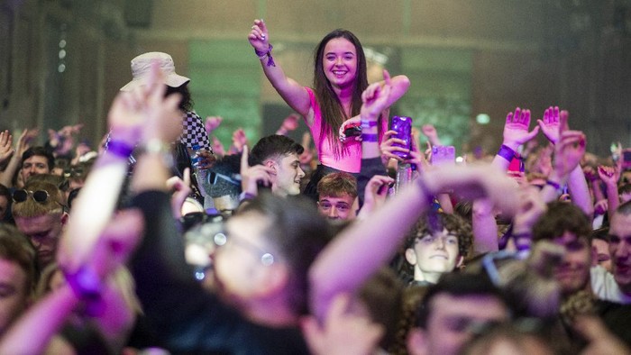LIVERPOOL, ENGLAND - APRIL 30: Confetti is fired into the crowd as Nightclub Circus hosts the first dance event, which will welcome 6,000 clubbers to the city's Bramley-Moore Dock warehouse on April 30, 2021 in Liverpool, England. The event is part of the national Events Research Programme which will provide data on how events could be permitted to safely reopen. (Photo by Anthony Devlin/Getty Images)