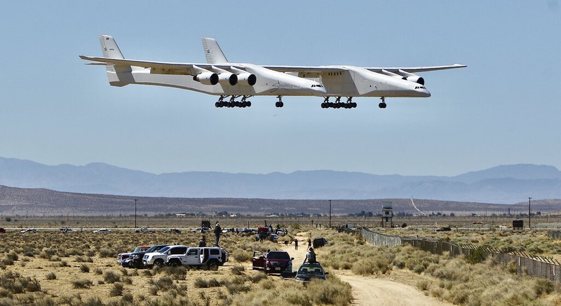 The Stratolaunch aircraft, a six-engine jet with the world's longest wingspan takes off from Mojave Air and Space Port during craft's second flight, Thursday, April 29, 2021in Mojave, Calif. The gigantic aircraft has flew for the second time in two years.  (AP Photo/Matt Hartman)