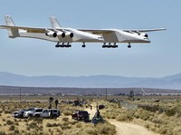 The Stratolaunch aircraft, a six-engine jet with the worlds longest wingspan takes off from Mojave Air and Space Port during crafts second flight, Thursday, April 29, 2021in Mojave, Calif. The gigantic aircraft has flew for the second time in two years.  (AP Photo/Matt Hartman)