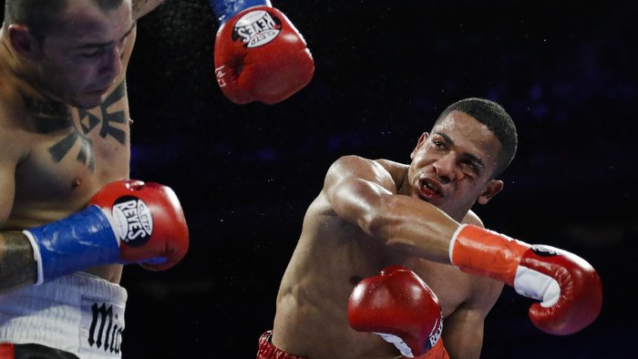FiLE - In this April 20, 2019 file photo, Puerto Ricos Felix Verdejo, right, punches Costa Ricas Bryan Vazquez during the fifth round of a lightweight boxing match in New York. Verdejo has turned himself in to federal agents on Saturday, May 1, 2021, just hours after authorities identified the body of his 27-year-old lover Keishla Rodríguez in a lagoon in the U.S. territory, a couple of days after she was reported missing. (AP Photo/Frank Franklin II, File)