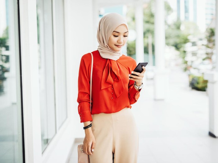 Portrait of Malaysian or Indonesian Muslim young woman with light blue colored hijab