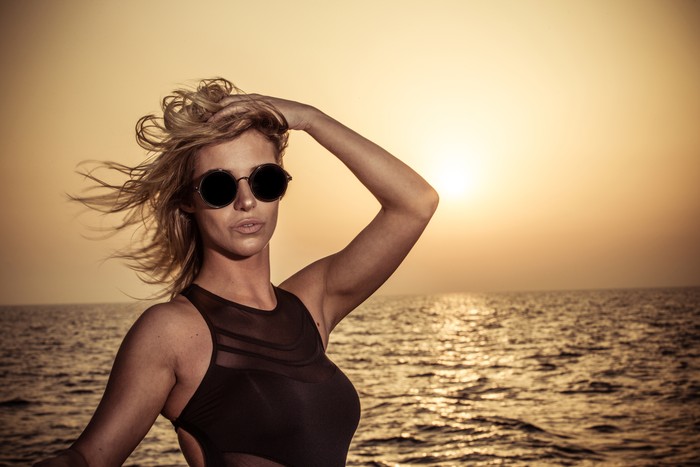 518393738 Attractive Model Looking at the Camera with the wind flowing.