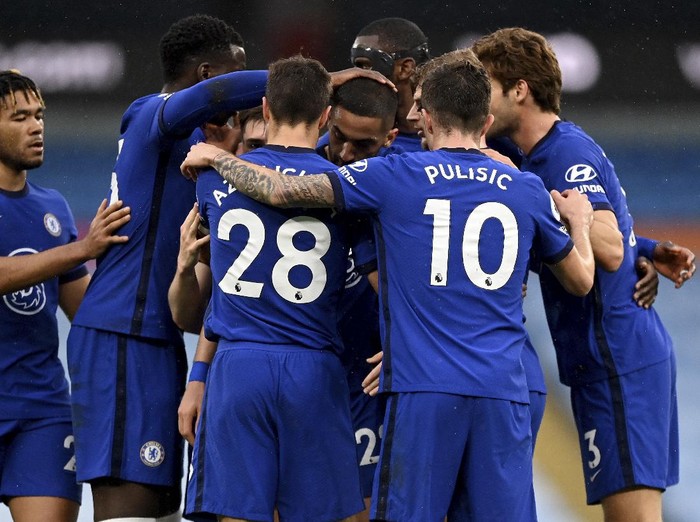 Chelsea players celebrate after scoring their side's first goal during the English Premier League soccer match between Manchester City and Chelsea at the Etihad Stadium in Manchester, Saturday, May 8, 2021.(Shaun Botterill /Pool via AP)