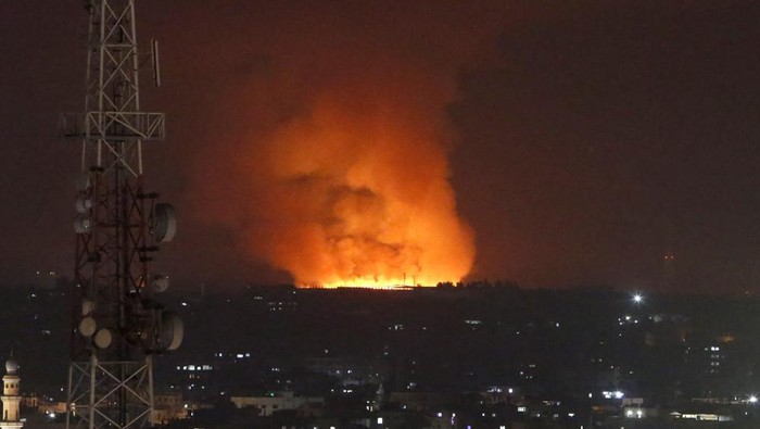 Fire burns and smoke rises after an Israeli forces strike in the Gaza Strip, Monday, May 10, 2021. (AP Photo/Hatem Moussa)