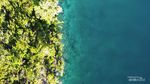 Menikmati Keindahan Pulau Togean dari Udara