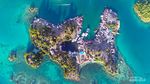 Menikmati Keindahan Pulau Togean dari Udara
