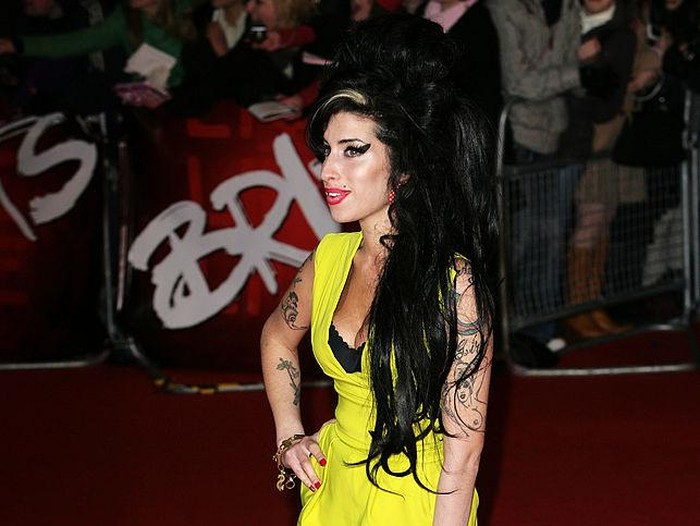Amy Winehouse LONDON - FEBRUARY 14: Singer Amy Winehouse arrives at the BRIT Awards 2007 in association with MasterCard at Earls Court on February 14, 2007 in London. (Photo by Gareth Cattermole/Getty Images)