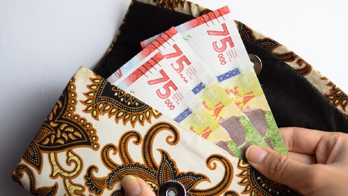 Uang pecahan Rp 75 ribu.