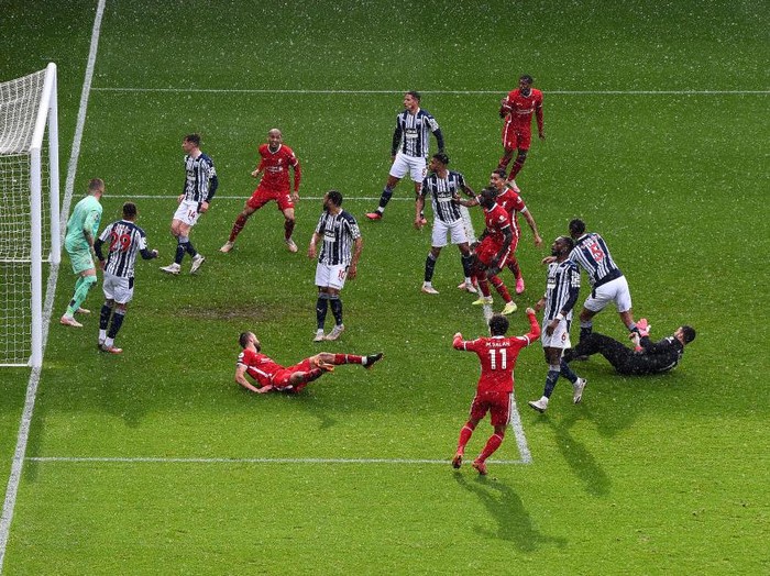 WEST BROMWICH, ENGLAND - MAY 16: Alisson Becker of Liverpool scores the winning goal past Sam Johnstone of West Bromwich Albion during the Premier League match between West Bromwich Albion and Liverpool at The Hawthorns on May 16, 2021 in West Bromwich, England. (Photo by Laurence Griffiths/Getty Images)