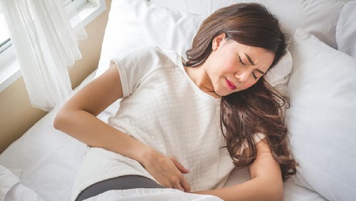Asian woman stomachache, feel pain for period conceptAsian woman stomachache, feel pain for period concept