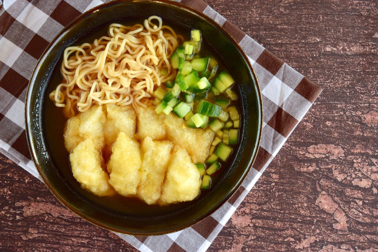 Pempek or mpek-mpek, popular savory fish cake dish from Palembang, South Sumatra, Indonesia. Served in sweet and sour sauce (kuah cuka) accompanied with egg noodle and cucumber