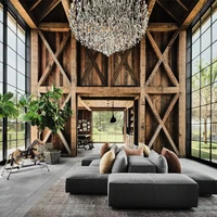 Sebagai vocal point, sebuah lampu kristal digantung di area ruang keluarga yang megah dengan kaca besar. Kami pikir, unik rasanya bila benda mewah ini digantung di dalam lumbung, seolah kontras dari properti ini, kata Mila. (Foto: Dok. Architectural Digest/Douglas Friedman)