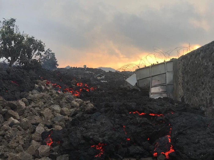 Smouldering ashes are seen early Sunday in Goma. [Moses Sawasawa/AFP]