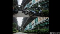 Petugas terlihat sibuk mengerjakan palang S untuk menghadang para pemotor masuk.