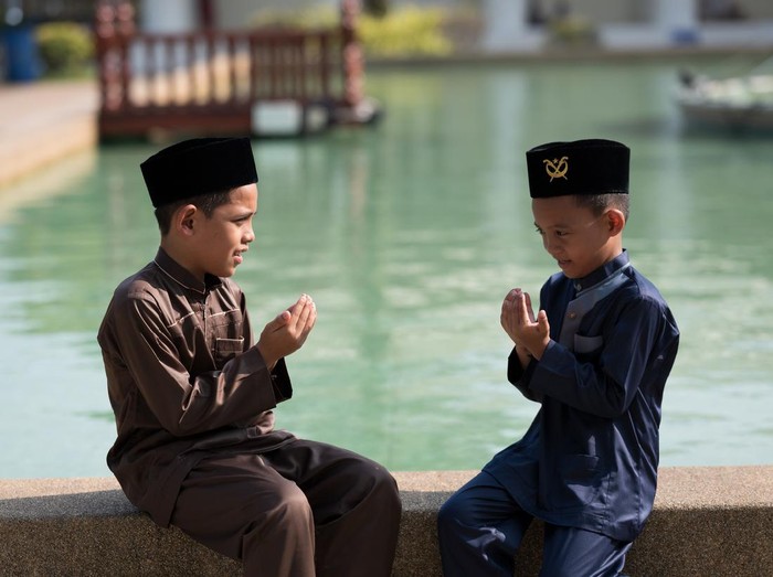 Muslim boy praying