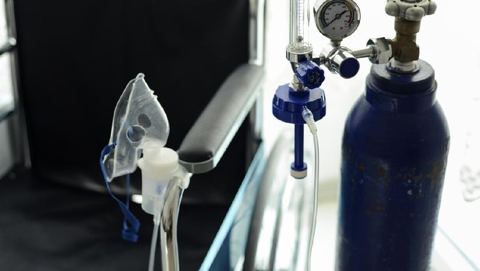 Close-Up Image Of Medical Oxygen Tube And The Wheelchair Behind It.