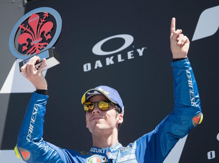 SCARPERIA, ITALY - MAY 30: Joan Mir of Spain and Team Suzuki ECSTAR celebrates the third place on the podium and remembers the young rider Jason Dupasquier of Swiss and Carxpert PrustelGP at the end of the MotoGP race during the MotoGP Of Italy - Race at Mugello Circuit on May 30, 2021 in Scarperia, Italy. (Photo by Mirco Lazzari gp/Getty Images)