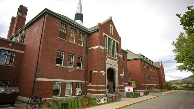 The former Kamloops Indian Residential School is seen on Tk'emlups te Secwépemc First Nation in Kamloops, British Columbia, Canada on Thursday, May 27, 2021. The remains of 215 children have been found buried on the site of the former residential school in Kamloops.  (Andrew Snucins/The Canadian Press via AP)
