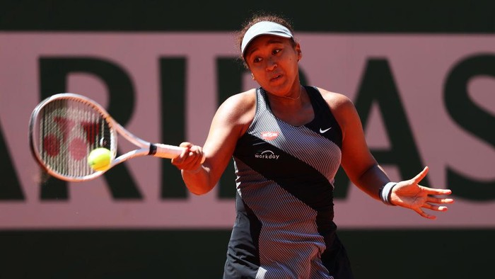 PARIS, FRANCE - MAY 30: Naomi Osaka of Japan plays a forehand in her First Round match against Patricia Maria Tig of Romania during Day One of the 2021 French Open at Roland Garros on May 30, 2021 in Paris, France. (Photo by Julian Finney/Getty Images)