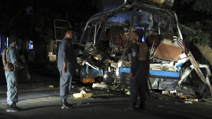 Afghan security personnel inspect the site of a bomb explosion in Kabul, Afghanistan, Tuesday, June 1, 2021. An Afghan government spokesman says two bombs exploded in quick succession in separate locations of a neighborhood in west Kabul, leaving multiple people dead and wounded. (AP Photo/Rahmat Gul)