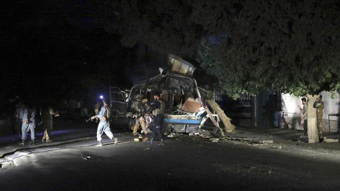 Afghan security personnel inspect the site of a bomb explosion in Kabul, Afghanistan, Tuesday, June 1, 2021. An Afghan government spokesman says two bombs exploded in quick succession in separate locations of a neighborhood in west Kabul, leaving multiple people dead and wounded. (AP Photo/Rahmat Gul)