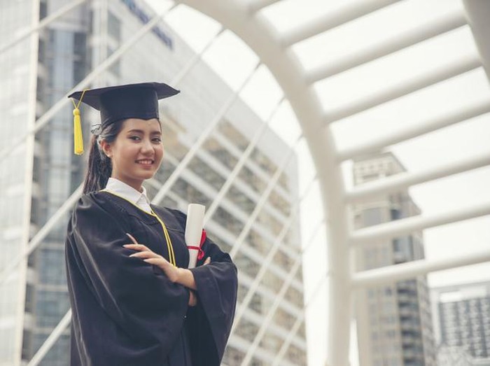 Graduate Student and Success Education in University Concept. Happy Asian student woman graduate diploma and MBA degree in asian college.
