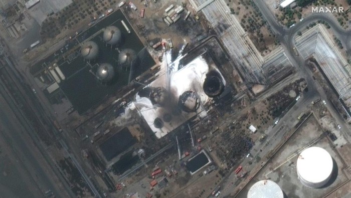 In this satellite photo provided by Maxar Technologies, firefighters try to extinguish a blaze at the state-owned Tondgooyan Petrochemical Co. just south of Tehran, Iran Thursday, June 3, 2021. A massive fire that broke out at an oil refinery near Irans capital and sent a huge plume of black smoke into the sky over Tehran was extinguished on Thursday, after more than 20 hours, a news agency reported. (©2021 Maxar Technologies via AP)