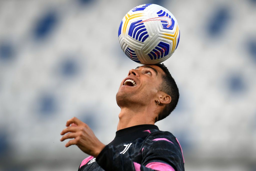 REGGIO NELL'EMILIA, ITALY - MAY 12: Cristiano Ronaldo of Juventus warms up prior to the Serie A match between US Sassuolo and Juventus at Mapei Stadium - Città del Tricolore on May 12, 2021 in Reggio nell'Emilia, Italy. Sporting stadiums around Italy remain under strict restrictions due to the Coronavirus Pandemic as Government social distancing laws prohibit fans inside venues resulting in games being played behind closed doors.  (Photo by Alessandro Sabattini/Getty Images)