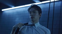 Dalam tone warna kebiruan, teaser ini berlanjut ke shot Junho yang tampil dengan kemeja, dasi, dan celana formal. (Foto: dok. JYP Entertainment) 
