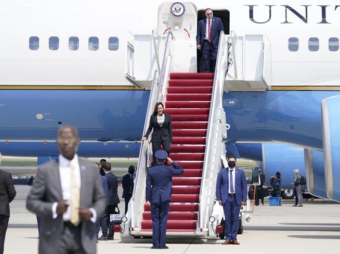 Vice President Kamala Harris is greeted by United States Air Force Lt. Col. Neil Senkowski as she deplanes Air Force Two after a technical issue forced the aircraft to return and land at Andrews Air Force Base, Md., Sunday, June 6, 2021, as she was en route to Guatemala City. (AP Photo/Jacquelyn Martin)