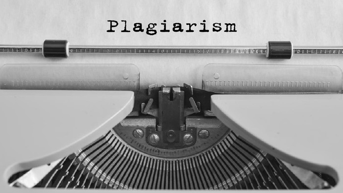 Plagiarism typed on an old typewriter. vintage thing. Copyright. Close-up