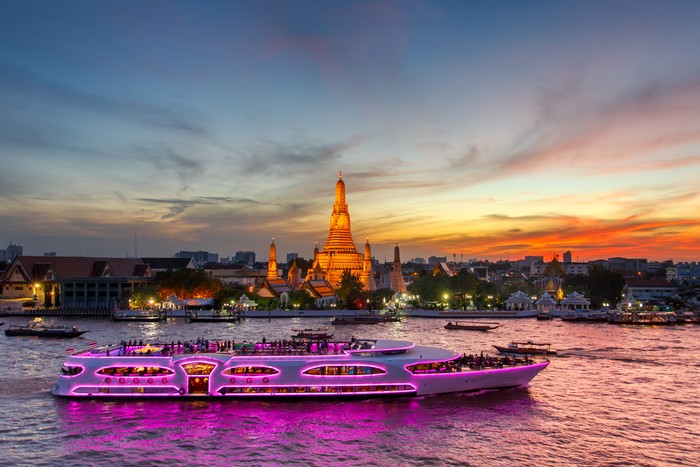 Wat Arun and cruise ship in twilight time, Bangkok city,Thailand