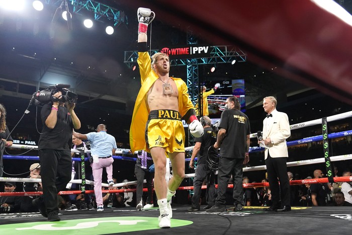 Logan Paul walks into the ring for an exhibition boxing match against Floyd Mayweather at Hard Rock Stadium, Sunday, June 6, 2021, in Miami Gardens, Fla. (AP Photo/Lynne Sladky)