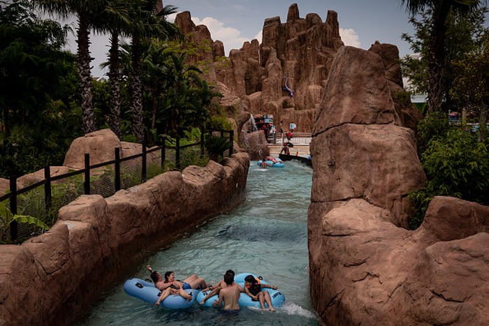 Serunya Liburan Musim Panas di Turki ANTALYA, TURKEY - JUNE 08: Tourists enjoy a water attraction at the Land Of Legends theme park on 08 June, 2021 in Antalya, Turkey. Turkeyβs tourism sector is preparing for the start of peak tourism season in July, and many resorts and businesses are hoping for a rebound year after revenues were cut by 65% in 2020 amid the fallout from the pandemic. Turkey has recently eased some coronavirus restrictions, including partially lifting weekend lockdowns and allowing restaurants and cafes to open under restricted hours and to a limited number of guests. Despite a decrease in coronavirus cases and the lifting of some restrictions Russia, Turkeys top source of tourists, recently suspended flights to Turkey until June 21 and Great Britain, Turkeyβs third largest source of tourists continues to list Turkey on their travel ban βred Listβ (Photo by Chris McGrath/Getty Images)