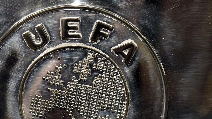NYON, SWITZERLAND - JULY 18:  The UEFA logo is seen on the UEFA Champions League trophy as it is prepared for the UEFA 2014/15 Champions League third qualifying rounds draw at the UEFA headquarters, The House of European Football, on July 18, 2014 in Nyon, Switzerland.  (Photo by Harold Cunningham/Getty Images for UEFA)
