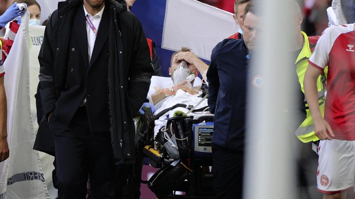 Christian Eriksen, Denmark Paramedics using a stretcher to take out of the pitch Denmarks Christian Eriksen after he collapsed during the Euro 2020 soccer championship group B match between Denmark and Finland at Parken stadium in Copenhagen, Denmark, Saturday, June 12, 2021. (Friedemann Vogel/Pool via AP)