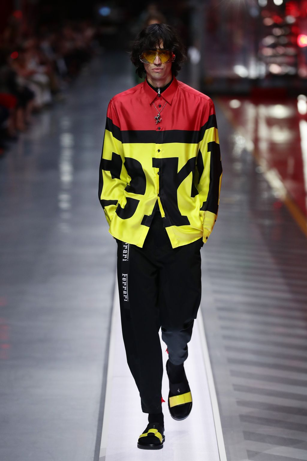 MARANELLO, ITALY - JUNE 13:  A model walks the runway at the fashion debut of the first co-ed Ferrari collection at Ferrari Factory on June 13, 2021 in Maranello, Italy. (Photo by Vittorio Zunino Celotto/Getty Images)