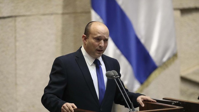 Israels new prime minister Naftali Bennett holds a first cabinet meeting in Jerusalem Sunday, June 13, 2021. Israels parliament has voted in favor of a new coalition government, formally ending Prime Minister Benjamin Netanyahus historic 12-year rule. Naftali Bennett, a former ally of Netanyahu became the new prime minister (AP Photo/Ariel Schalit)