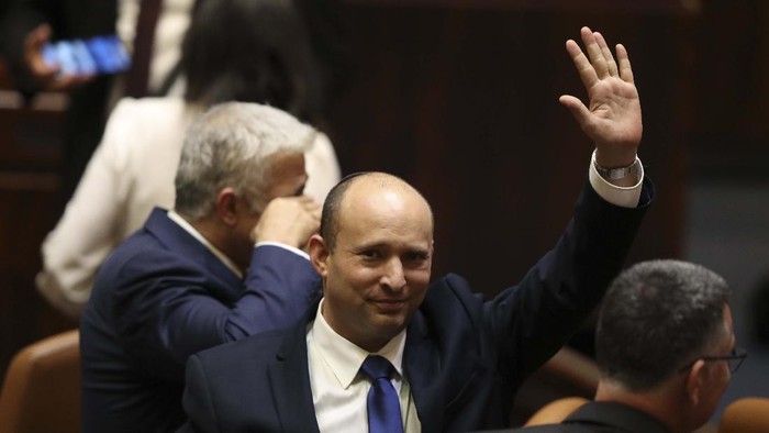 Israels new prime minister Naftali Bennett holds a first cabinet meeting in Jerusalem Sunday, June 13, 2021. Israels parliament has voted in favor of a new coalition government, formally ending Prime Minister Benjamin Netanyahus historic 12-year rule. Naftali Bennett, a former ally of Netanyahu became the new prime minister (AP Photo/Ariel Schalit)