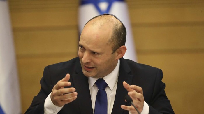 Israels new prime minister Naftali Bennett holds a first cabinet meeting in Jerusalem Sunday, June 13, 2021. Israels parliament has voted in favor of a new coalition government, formally ending Prime Minister Benjamin Netanyahus historic 12-year rule. Naftali Bennett, a former ally of Netanyahu became the new prime minister (AP Photo/Ariel Schalit)