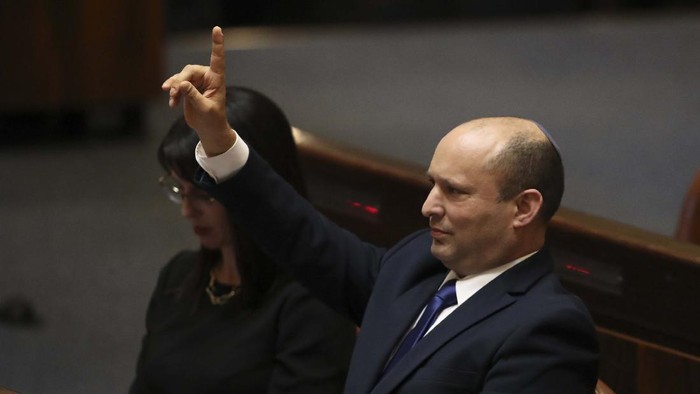 Israels new prime minister Naftali Bennett holds a first cabinet meeting in Jerusalem Sunday, June 13, 2021. Israels parliament has voted in favor of a new coalition government, formally ending Prime Minister Benjamin Netanyahus historic 12-year rule. Naftali Bennett, a former ally of Netanyahu became the new prime minister (AP Photo/Ariel Schalit)