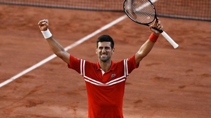 Serbias Novak Djokovic celebrates as he defeats Stefanos Tsitsipas of Greece during their final match of the French Open tennis tournament at the Roland Garros stadium Sunday, June 13, 2021 in Paris. (AP Photo/Thibault Camus)