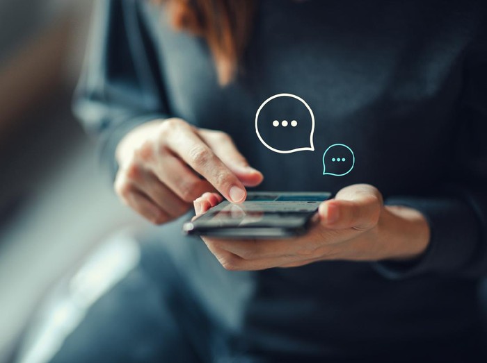 Womens hand typing on mobile smartphone, Live Chat Chatting on application Communication Digital Web and social network Concept. Work from home.