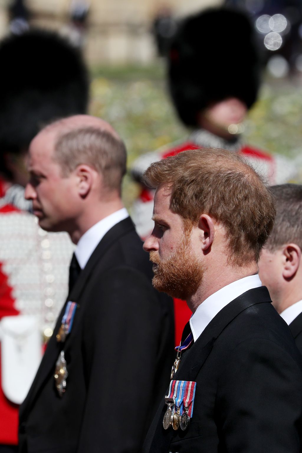 WINDSOR, ENGLAND - APRIL 17: Prince William, Duke of Cambridge; Prince Harry, Duke of Sussex and Peter Phillips walk behind Prince Philip, Duke of Edinburgh's coffin, carried by a Land rover hearse, in a procession during the funeral of Prince Philip, Duke of Edinburgh at Windsor Castle on April 17, 2021 in Windsor, United Kingdom. Prince Philip of Greece and Denmark was born 10 June 1921, in Greece. He served in the British Royal Navy and fought in WWII. He married the then Princess Elizabeth on 20 November 1947 and was created Duke of Edinburgh, Earl of Merioneth, and Baron Greenwich by King VI. He served as Prince Consort to Queen Elizabeth II until his death on April 9 2021, months short of his 100th birthday. His funeral takes place today at Windsor Castle with only 30 guests invited due to Coronavirus pandemic restrictions. (Photo by Mark Large-WPA Pool/Getty Images)
