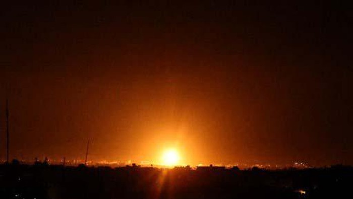 Explosions light-up the night sky at Khan Yunis in the southern Gaza Strip, as Israeli forces shell the Palestinian enclave, early on June 16, 2021. (Photo by SAID KHATIB / AFP)
