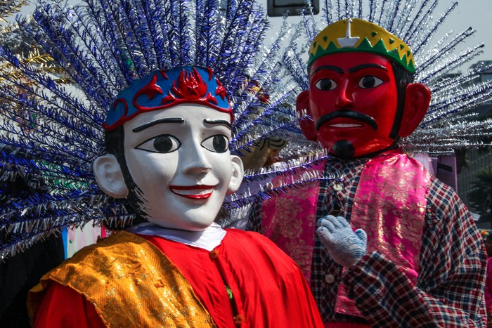 Jakarta, October 20, 2014 : Ondel-ondel were performed at a festival event in Jakarta, Indonesia. Ondel-Ondel is a kind of traditional performance from the native people of Jakarta and it is usually performed as a folk performance from Betawi, the . Ondel-ondel are always come in couple, with both male in red face and female in white.