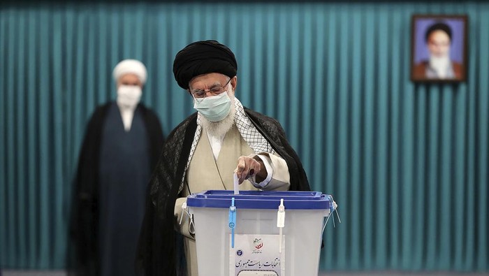 In this picture released by the official website of the office of the Iranian supreme leader, Supreme Leader Ayatollah Ali Khamenei casts his ballot for the presidential elections, in Tehran, Iran, Friday, June 18, 2021. Iran began voting Friday in a presidential election tipped in the favor of a hard-line protege of Supreme Leader Ayatollah Ali Khamenei, fueling public apathy and sparking calls for a boycott in the Islamic Republic. (Office of the Iranian Supreme Leader via AP)