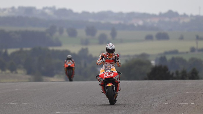 HOHENSTEIN-ERNSTTHAL, GERMANY - JUNE 20:  Marc Marquez of Spain and Repsol Honda Team cuts the finish lane and celebrates the victory during the MotoGP race during the MotoGP of Germany - Race at Sachsenring Circuit on June 20, 2021 in Hohenstein-Ernstthal, Germany. (Photo by Mirco Lazzari gp/Getty Images)