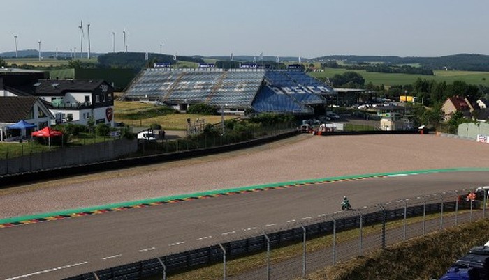 Empty stands can be seen during a free practice session of the German motorcycle Grand Prix at the Sachsenring racing circuit in Hohenstein-Ernstthal near Chemnitz, eastern Germany, on June 19, 2021. (Photo by Ronny Hartmann / AFP)